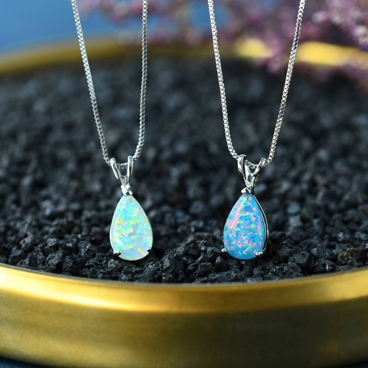 Rose gold minimalist opal drop pendant. Women's necklace featuring a beautiful gemstone.