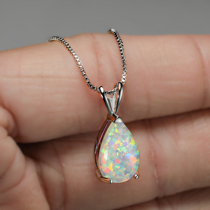 Silver minimalist opal drop pendant necklace. Elegant gemstone jewelry, a timeless gift for her.