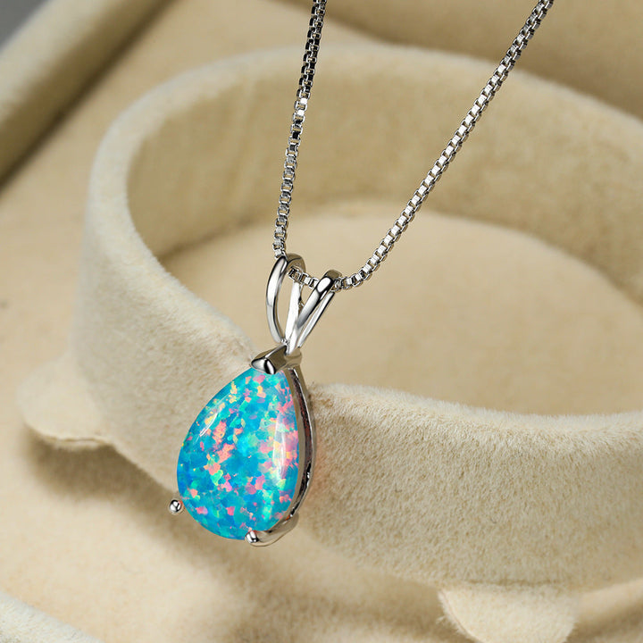 Iridescent opal gemstone drop pendant necklace. Minimalist women's jewelry, rose gold finish.