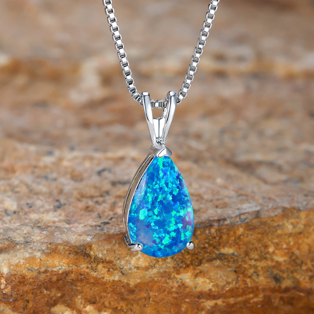 Women's elegant opal drop pendant necklace. Adjustable chain, minimalist design, a perfect gift.