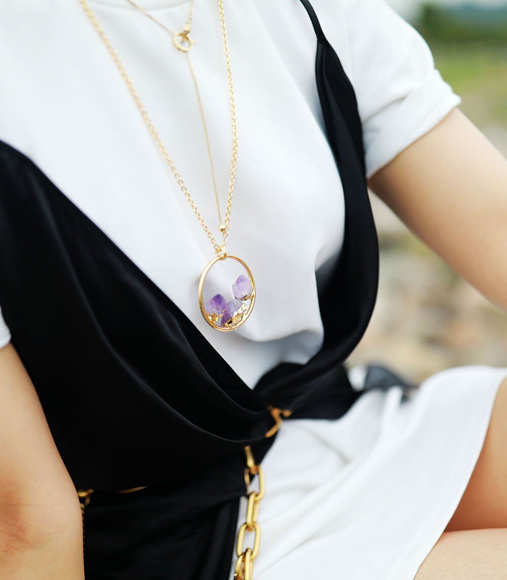 Calming raw amethyst stone necklace for women, a beautiful handmade crystal gemstone pendant on a minimalist silver chain.