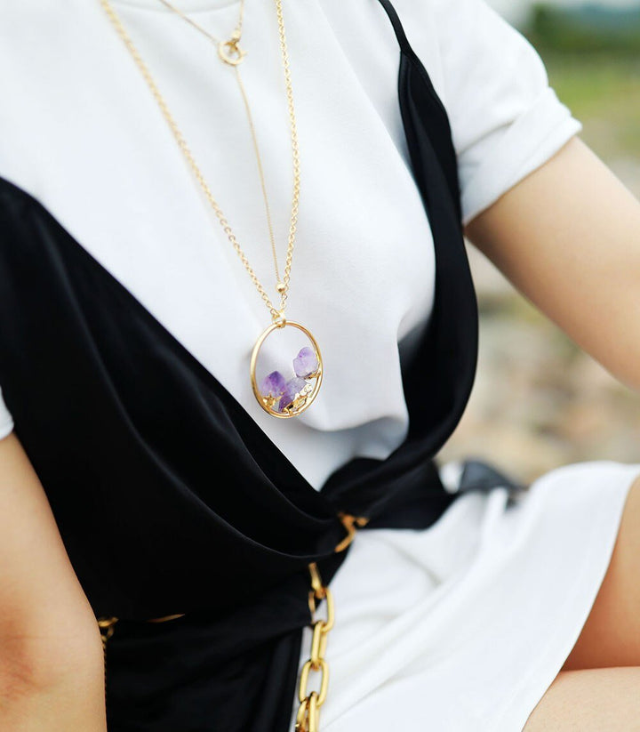 Calming raw amethyst stone necklace for women, a beautiful handmade crystal gemstone pendant on a minimalist silver chain.