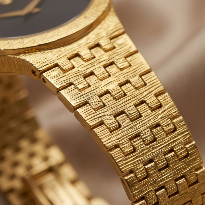 Delicate Seraphine women's watch, a minimalist gold timepiece with a classic black dial, perfect for elegant timeless wear.