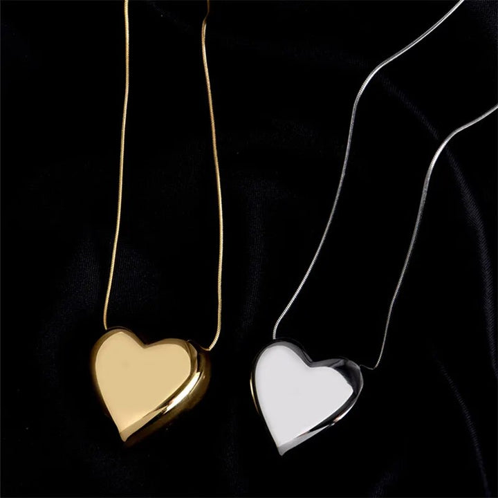 Elegant simple heart pendant necklace for women. Minimalist design, a timeless delicate stainless steel jewelry piece.