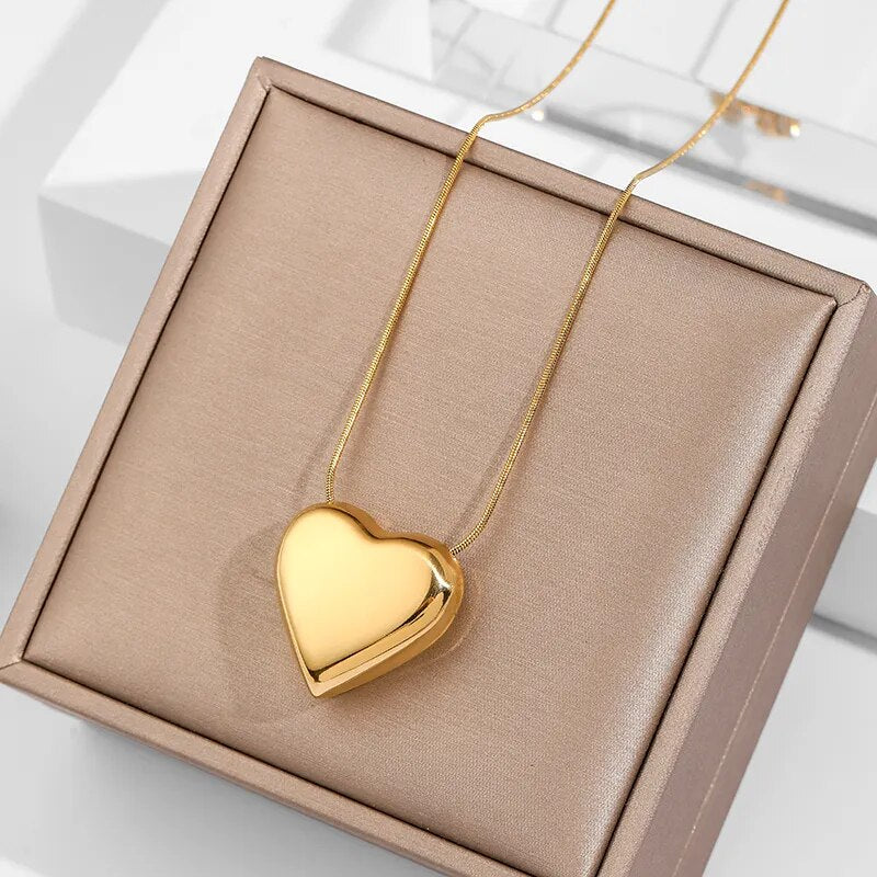 Gift for her: minimalist stainless steel heart pendant necklace. Simple, elegant women's jewelry, a delicate accessory.