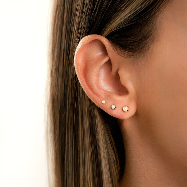 Women's minimalist sterling silver stud earrings, 18K gold plated. Delicate everyday jewelry.