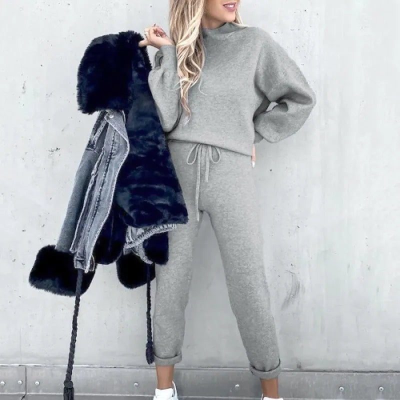Women's balloon sleeve mock neck two-piece outfit. Drawstring pants for a relaxed fit.