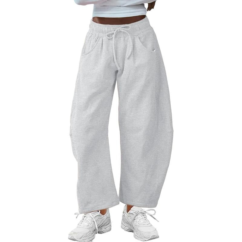 Modern women's barrel-leg pants with a relaxed fit and drawstring waist, offering comfortable, chic style.