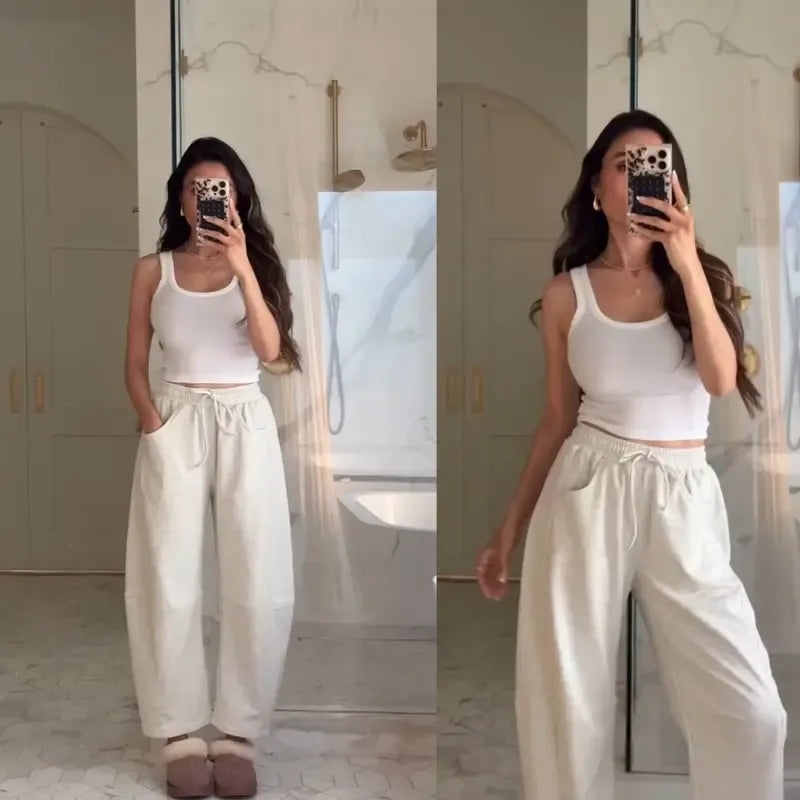 Effortless women's barrel-leg pants, featuring a relaxed fit and comfortable drawstring waist for stylish casual looks.
