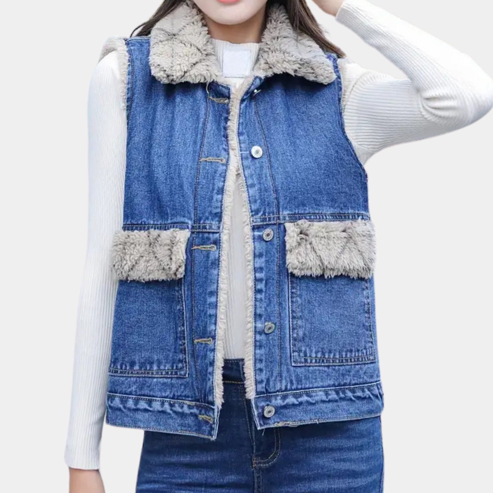 Women's modern blue denim gilet. Chic sleeveless jacket, perfect casual layering piece for transitional weather.