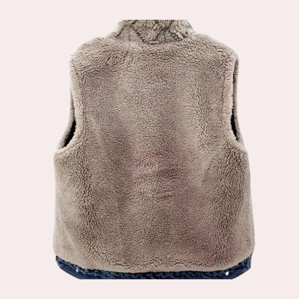 Front view of a women's modern denim gilet in blue. Casual sleeveless jacket, perfect transitional outerwear.