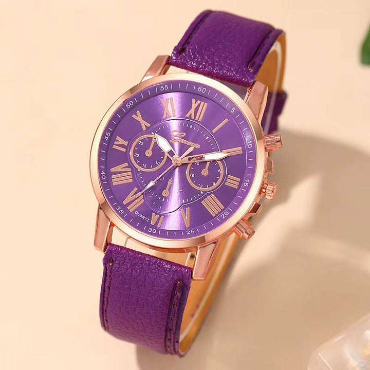 Women's modern chronograph watch with elegant Roman numerals & gold-tone accents.