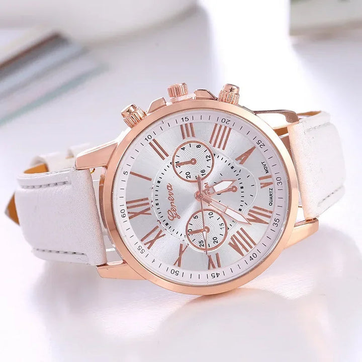 Women's modern chronograph watch, featuring a colorful dial, gold-tone case & Roman numerals.