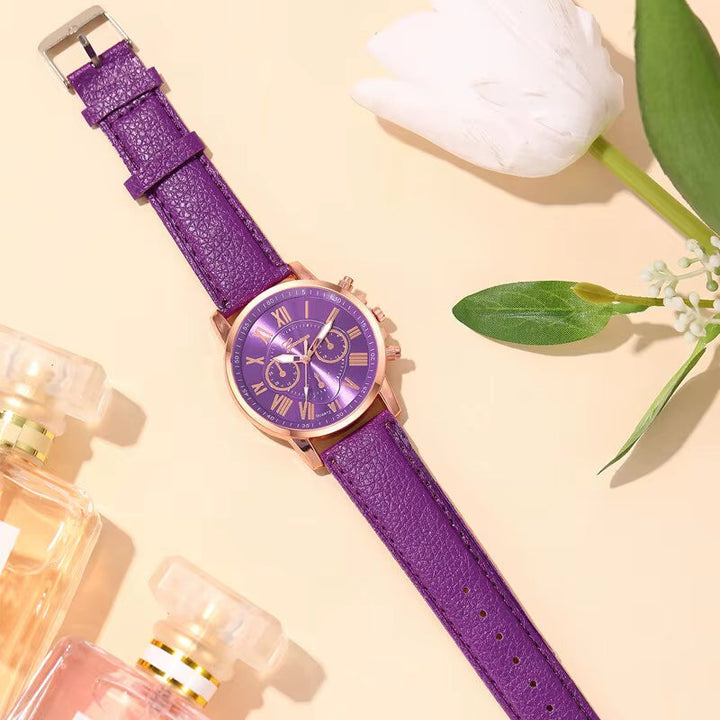 Modern women's quartz watch, a colorful chronograph with gold-tone finish & Roman numerals.