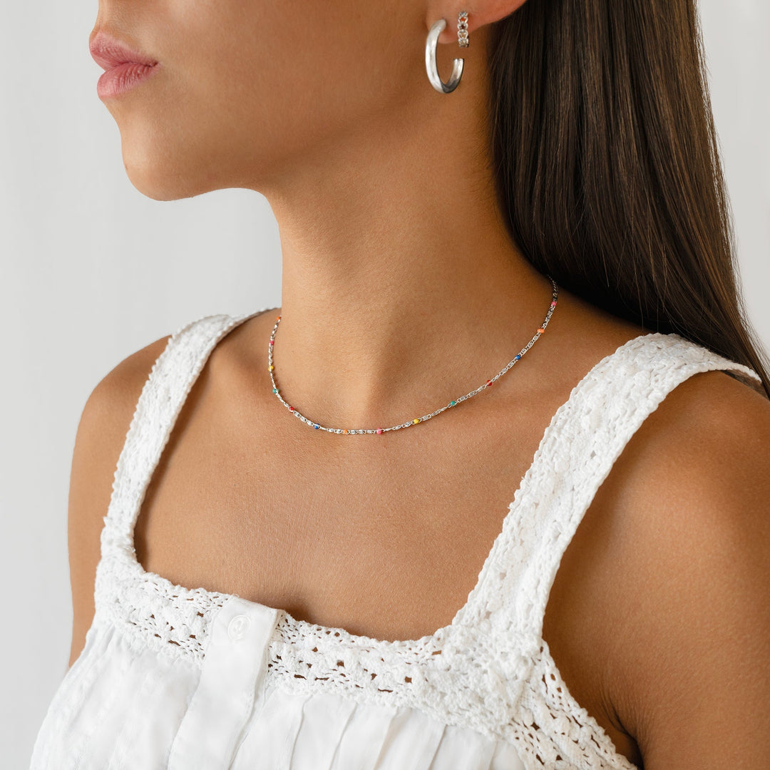 Modern women's half-round sterling silver hoop earrings, a chic minimalist addition to any jewelry collection.