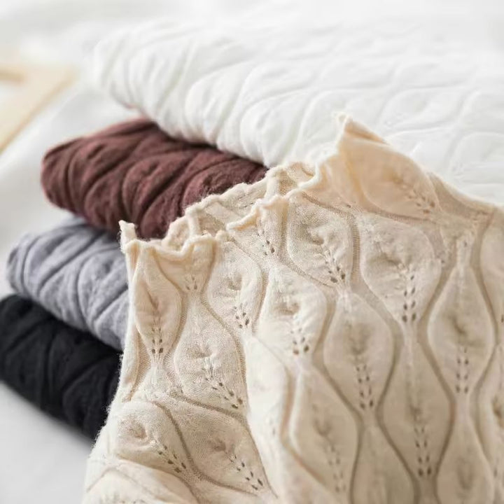 Warm, cozy women's moiré cashmere blend turtleneck sweater, essential for comfortable winter style.
