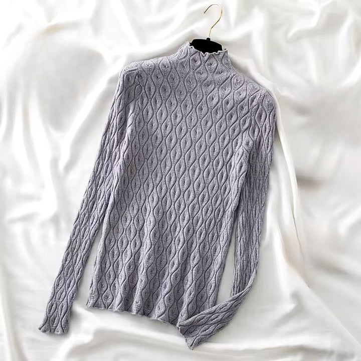 Stylish women's moiré cashmere blend turtleneck sweater, a unique and warm piece of knitwear.