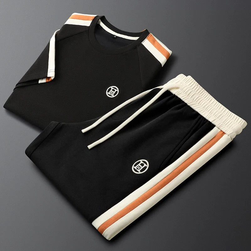 Embroidered women's striped Monaco tracksuit set. Chic two-piece comfortwear for travel & casual style.