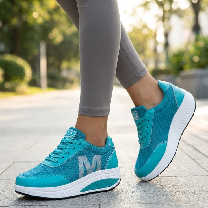 Women's Monica cushioned non-slip training shoes in black, athletic design with arch support.