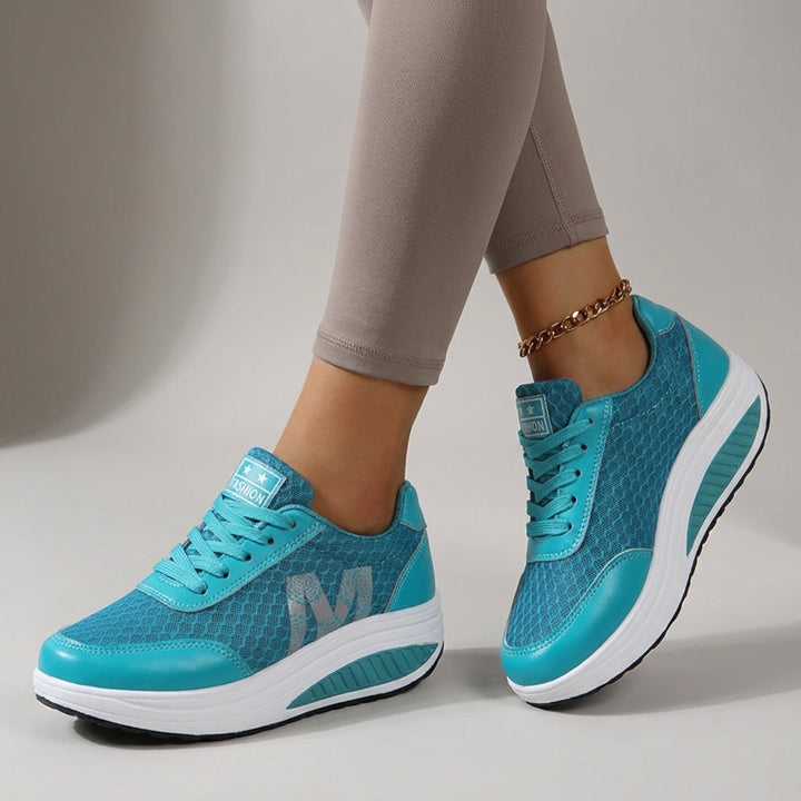 Pair of Monica women's training shoes, cushioned for comfort, non-slip sole, ideal for gym workouts.