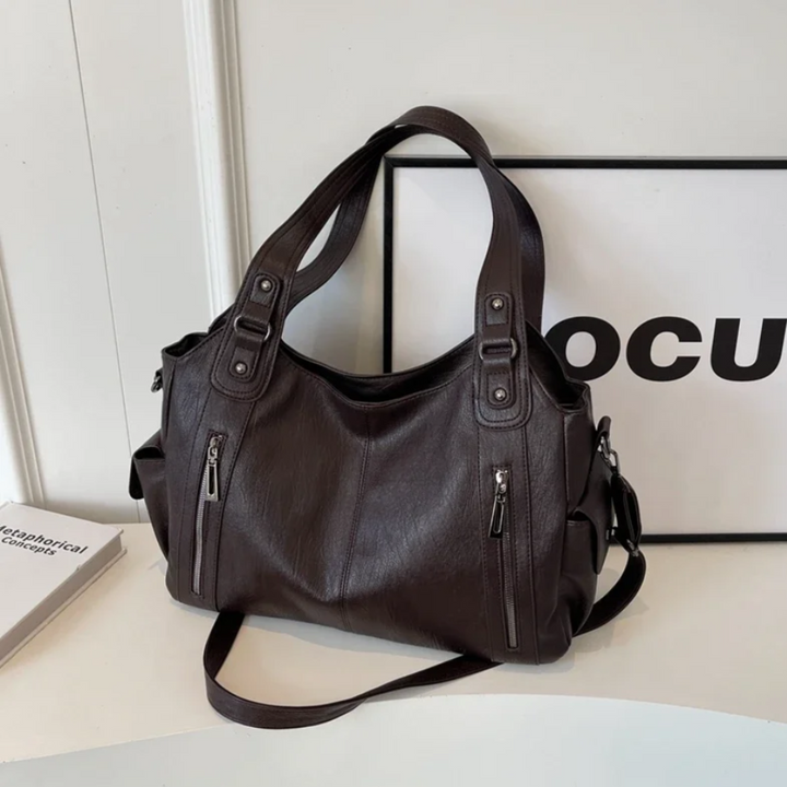 Maroon multi-compartment women's handbag. Stay organized with this versatile daily carry shoulder bag.