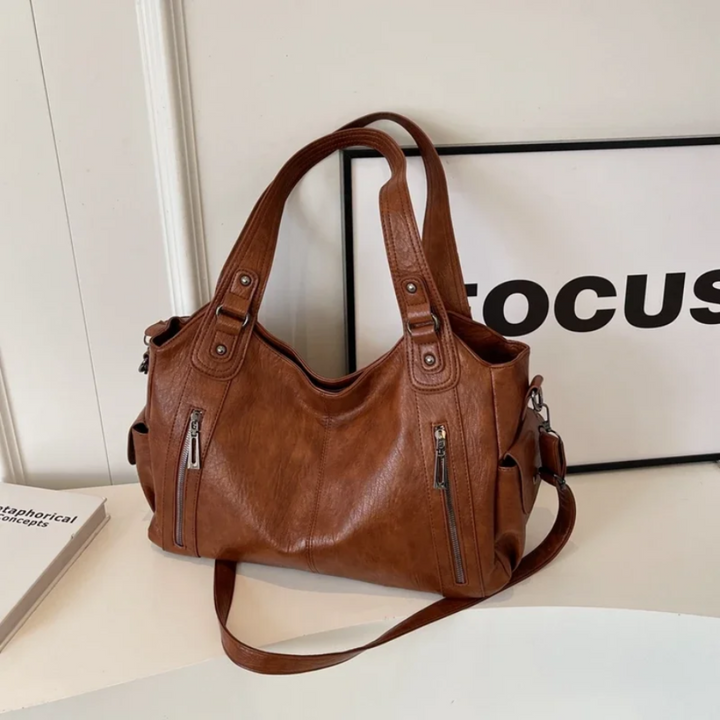 Durable multi-compartment women's shoulder bag. An excellent travel accessory or organized work bag.