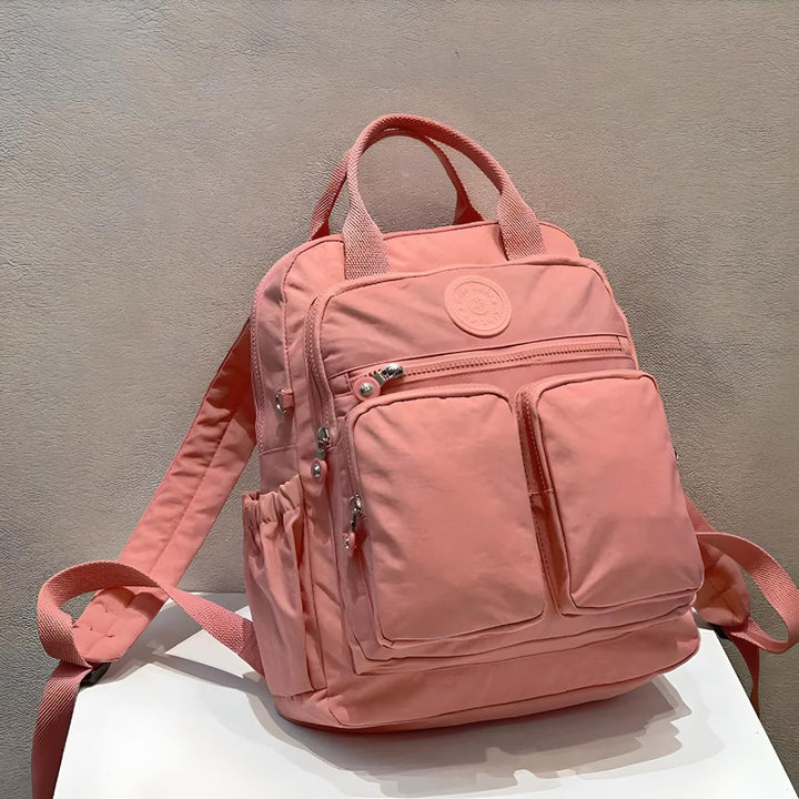 Durable women's travel backpack, multi-pocket, waterproof for reliable daily and travel use.
