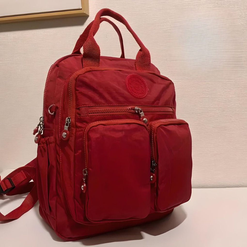 Waterproof multi-pocket women's commuter backpack, stylish and durable for daily essentials.