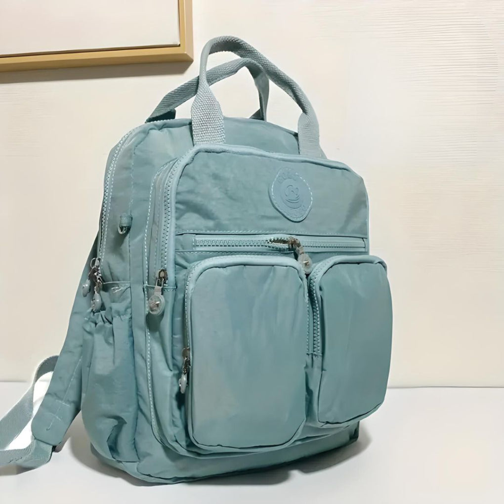 Women's college backpack, multi-pocket and waterproof, ideal for students and daily carry.