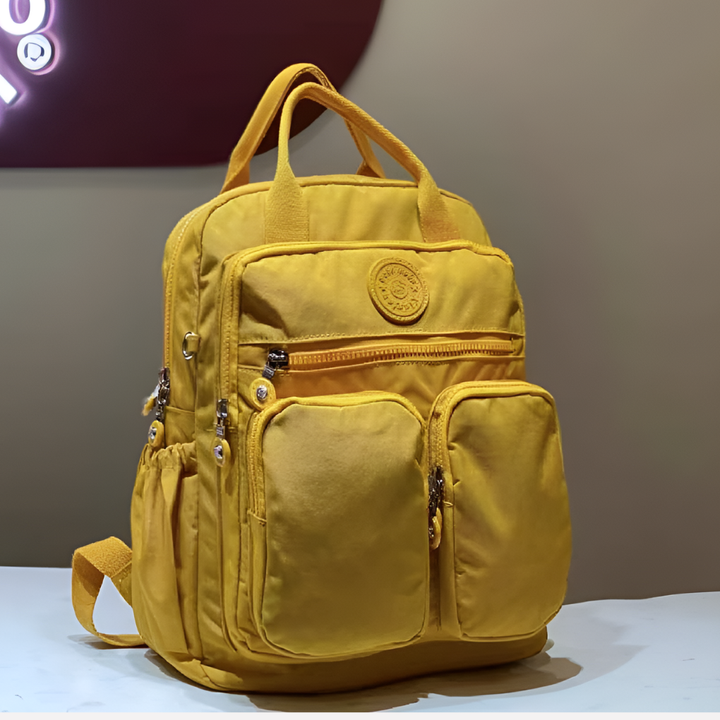 Organized women's travel backpack, multi-pocket for essentials, stylish and waterproof.