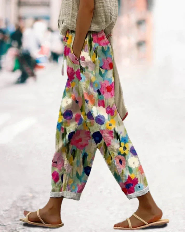 Women's multicolor bohemian floral print pants with pockets & relaxed tapered leg for summer comfort.