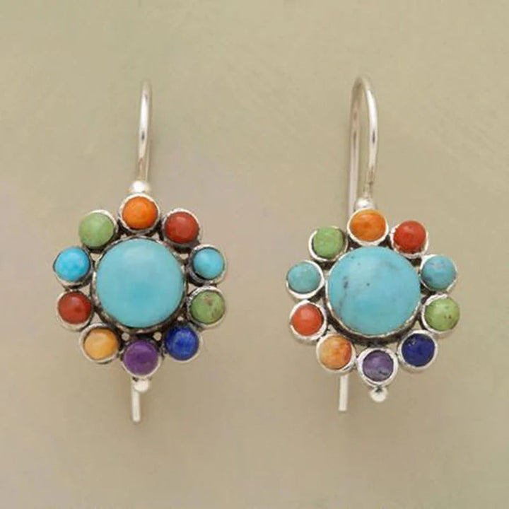 Women's multicolored round turquoise earrings with silver accents, perfect for a vibrant boho chic look.