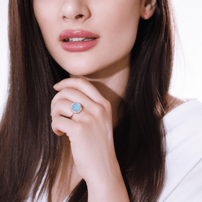 Adjustable blue opal gemstone ring for women, handmade with unique mystical flair. Elegant jewelry.