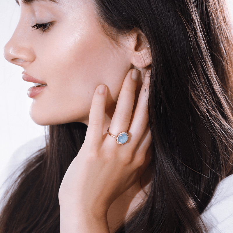 Elegant women's cocktail ring with a vibrant opal gemstone, adding mystical allure to any outfit.