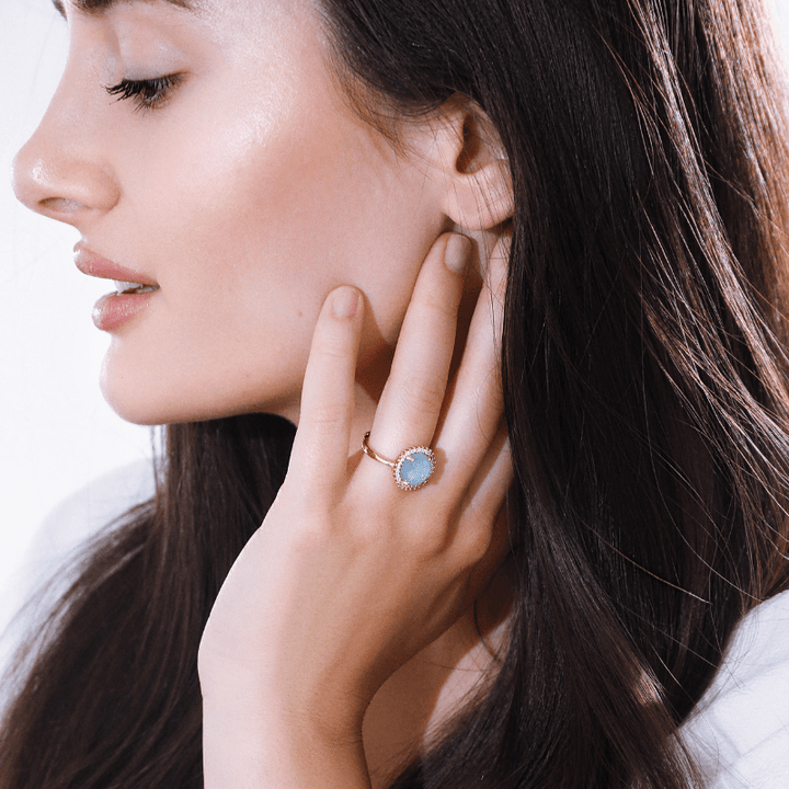 Elegant women's cocktail ring with a vibrant opal gemstone, adding mystical allure to any outfit.