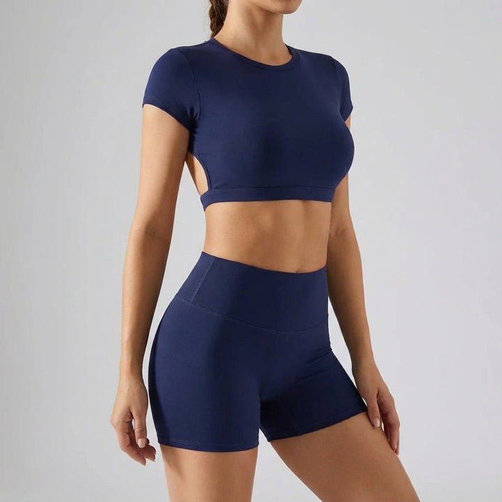 Full view of women's Nancy performance fabric sports set, pink two-piece workout clothes