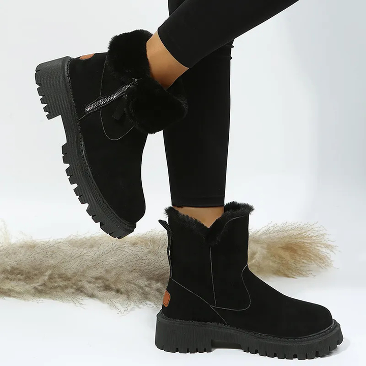 Stylish women's Nara ankle boots providing warm and comfortable support for snowy days and cold winter walks.
