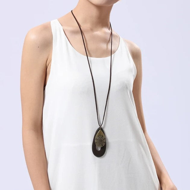 Elegant women's oval wood necklace, natural eco-friendly bohemian jewelry pendant.