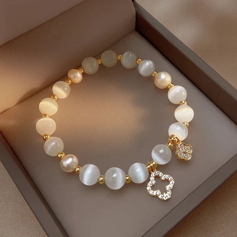 Beautiful women's crystal and pearl bracelet. Adjustable gold plated chain. Natural healing jewelry for women.