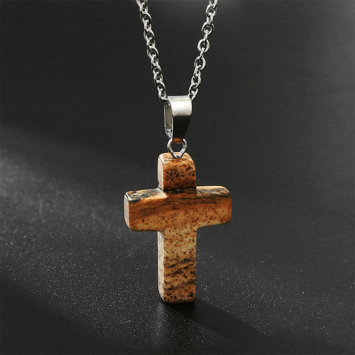 On-model shot: Women's adjustable gemstone cross pendant necklace, a chic fashion statement.