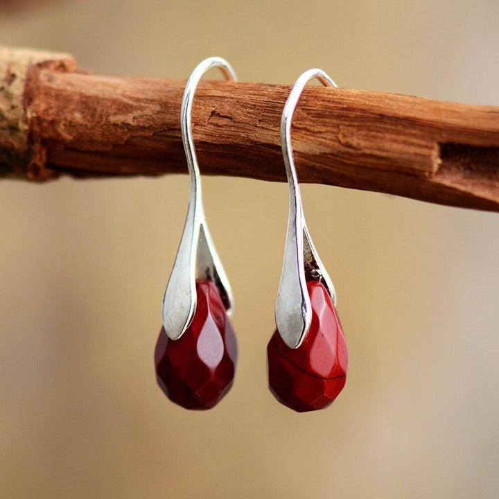 Women's natural gemstone dangle drop earrings in sterling silver, perfect boho jewelry with spiritual appeal.