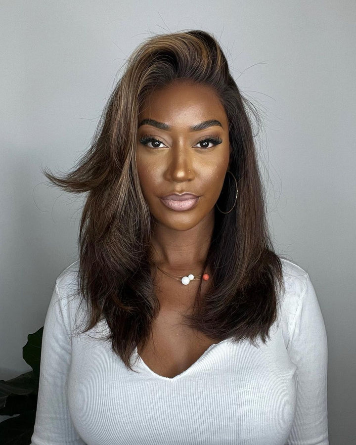 Flawless natural human hair lace front wig. Wavy brown hair with bright blonde highlights for a vibrant look.