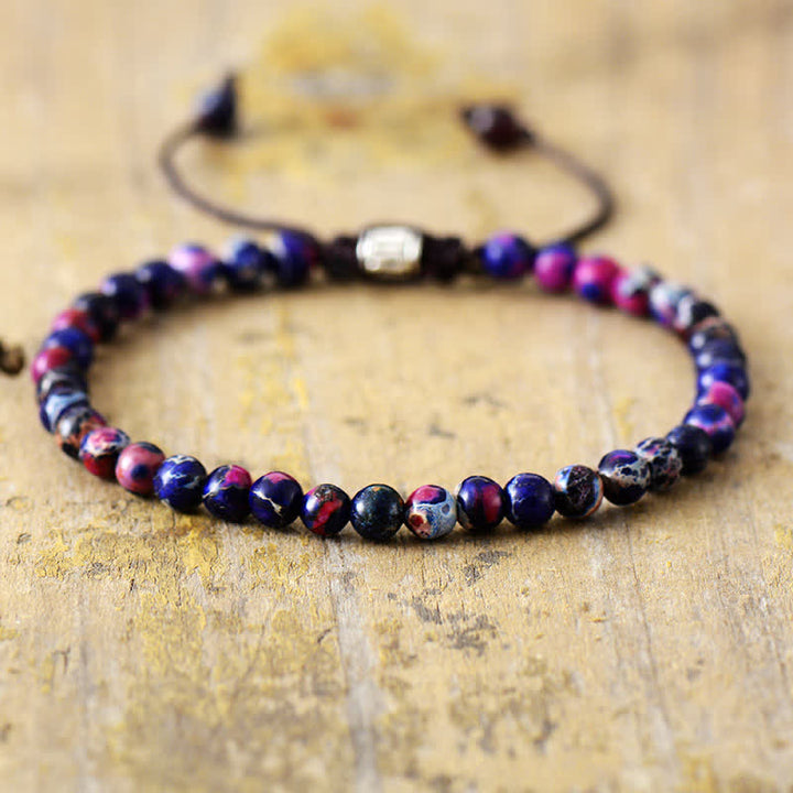 Women's natural stone & pearl adjustable braided bracelet. Elegant gemstone jewelry, fashion accessory.