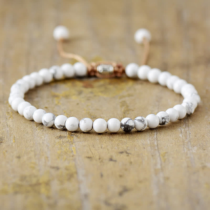 Natural stone beads and pearls intricately braided into an adjustable bracelet for women. Elegant.