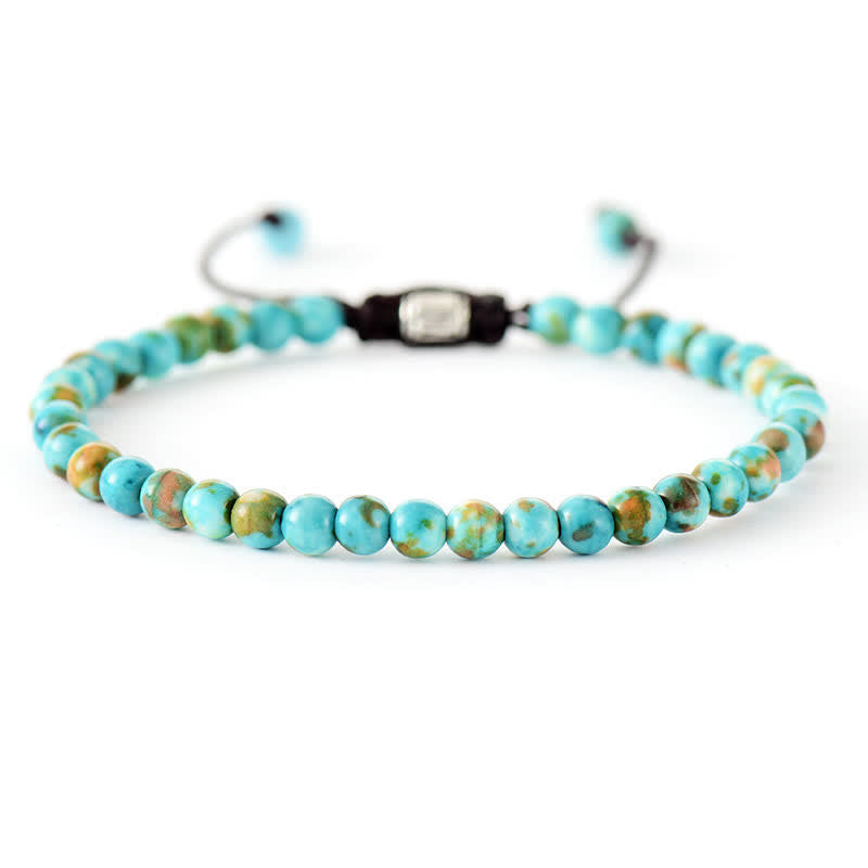Women's fashion accessory: Adjustable braided bracelet with natural gemstones and shimmering pearls.
