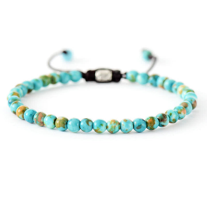 Women's fashion accessory: Adjustable braided bracelet with natural gemstones and shimmering pearls.