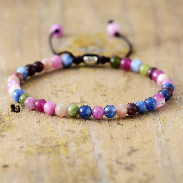 Elegant women's pearl & natural stone bracelet, adjustable braided design. Perfect fashion accessory.