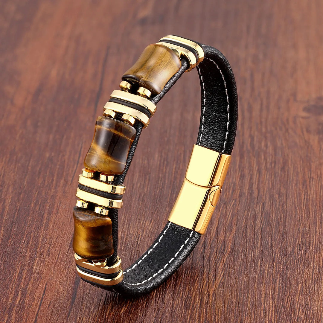 Elegant women's tiger eye gemstone and leather bracelet on a model's wrist