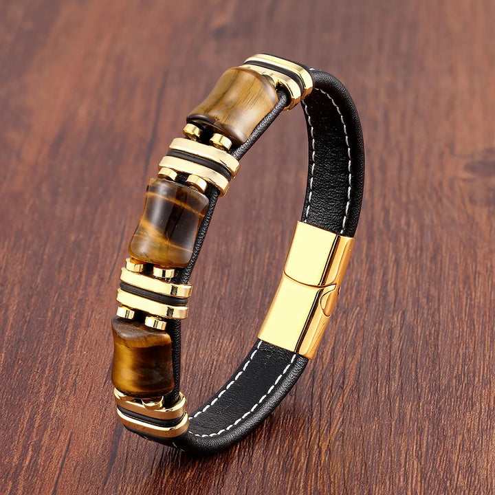 Elegant women's tiger eye gemstone and leather bracelet on a model's wrist