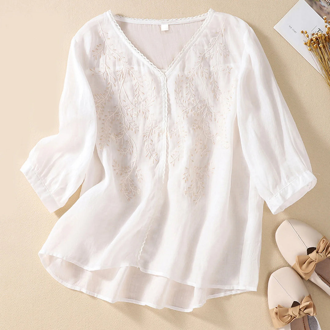Delicate nature-inspired embroidered top, women's comfortable summer blouse, versatile and chic apparel for any occasion.